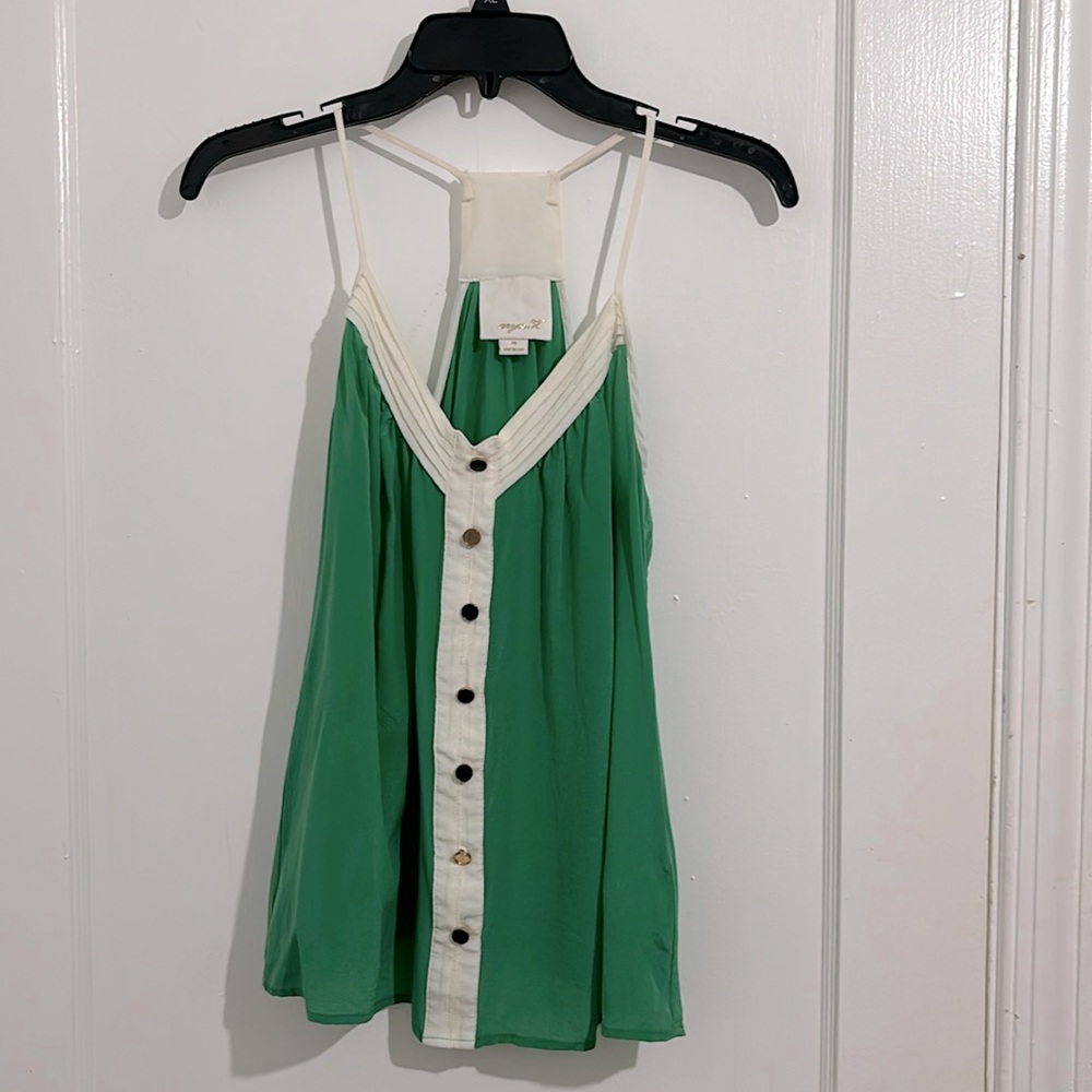 Aryn K. Medium green and white silk tank with beautiful buttons down the front.
